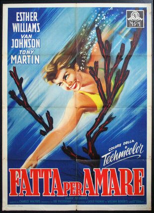 a movie poster of a woman swimming underwater