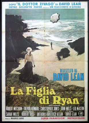 a movie poster of a woman walking on a beach