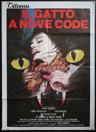 a movie poster with a woman biting a cat's head