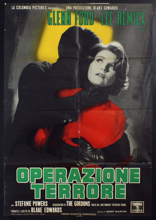 a poster of a shadowy man accosting and grabbing the throat of a woman from behind her