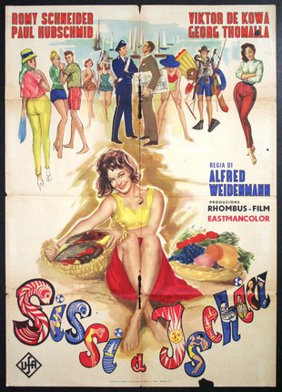 a movie poster with a woman sitting on a beach