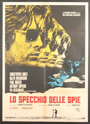 a movie poster with a few men wearing sunglasses