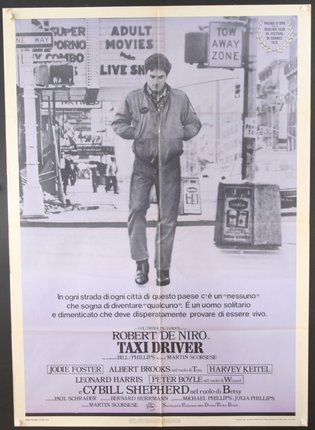 a poster of a man walking on a street