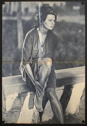 a woman sitting on a ledge