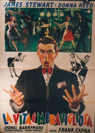 a man in a tuxedo with his hands up