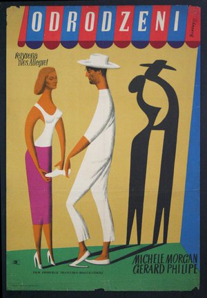 a man and woman standing on a green carpet