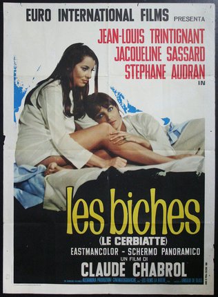 a movie poster of two people sitting on a bed