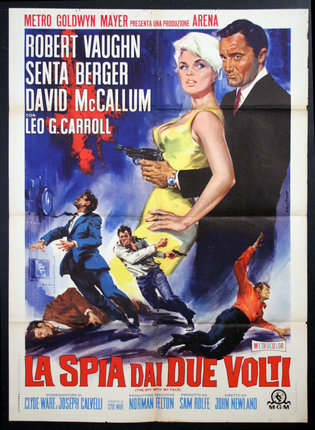 a movie poster with a man holding a woman and a gun