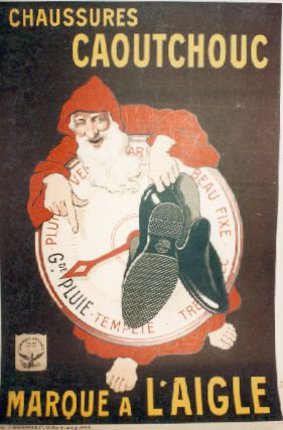 a poster with a santa claus pointing at a shoe