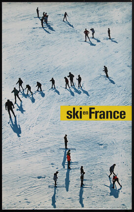 an arial view of many people learning to snow ski on a snowing plane.