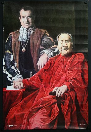 a man in a red robe sitting next to a man in a red robe