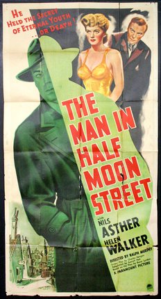 a movie poster of a man wearing a fedora and trenchcoat and a woman