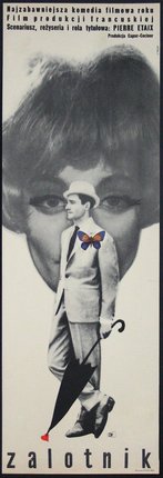 a man in a suit and hat with a butterfly on his chest