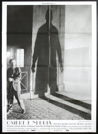 a man standing next to a shadow of a man
