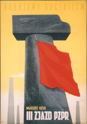 a large stone monument with a red flag