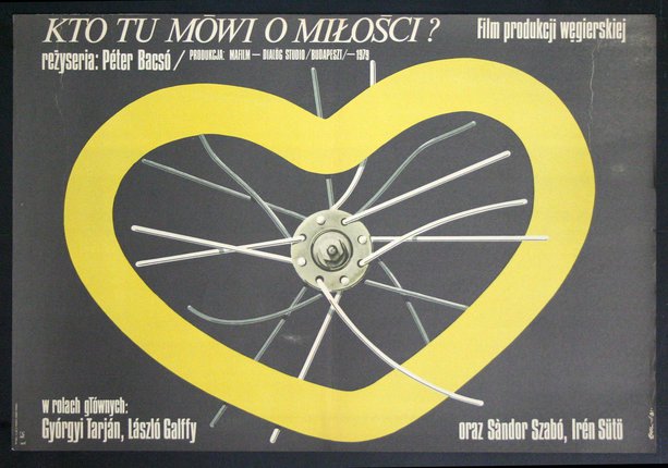 a yellow heart with spokes on a black background