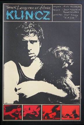 a poster of a man holding a dog