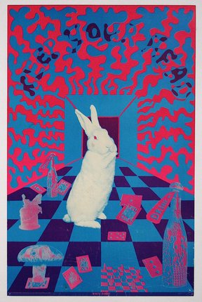 a white rabbit in a room with a checkered floor