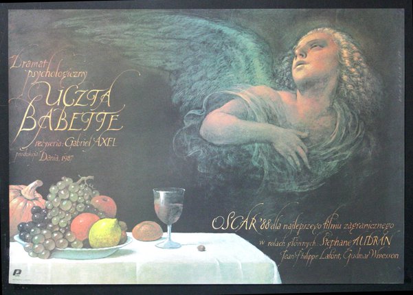 a poster of an angel and a plate of fruit