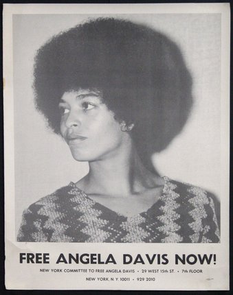 a black and white photo of a woman with a large afro