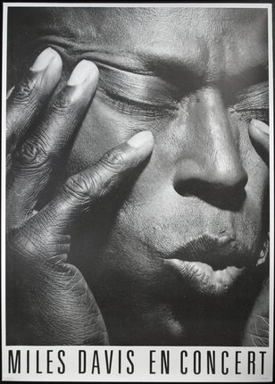 a close-up of a man with his hands on his face