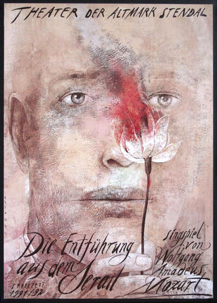 a poster with a man's face and a flower