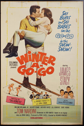 a movie poster with a man on skis carrying a woman