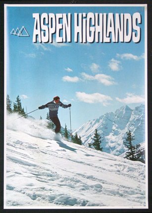a man skiing down a snowy mountain