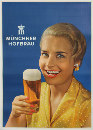 a woman holding a glass of beer