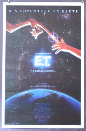 a movie poster of a hand reaching for a planet