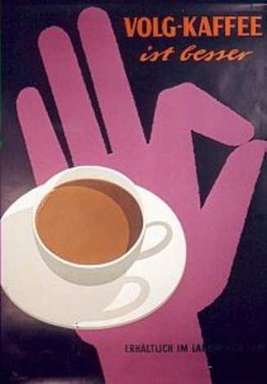 a cup of coffee on a plate with a hand