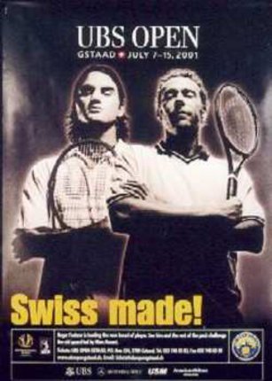 a couple of men holding tennis rackets