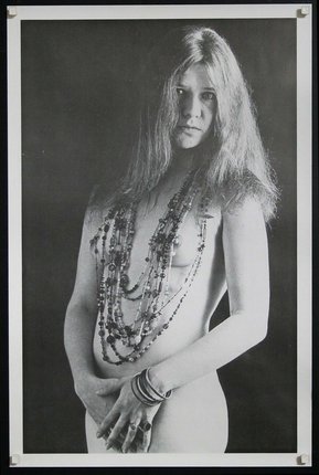 a woman with long hair and necklaces