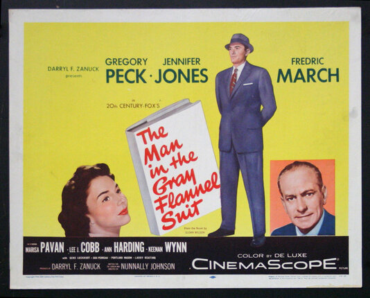 a movie poster with a man in a suit and a woman in a hat
