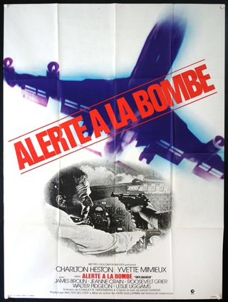 a movie poster with a man holding guns
