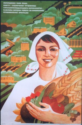 a woman holding a basket of wheat