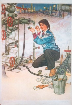 a woman working on a machine