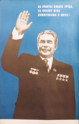 a man in a suit waving