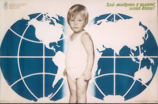 a child standing in front of a world map