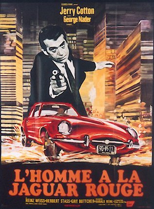a man pointing a gun to a red car
