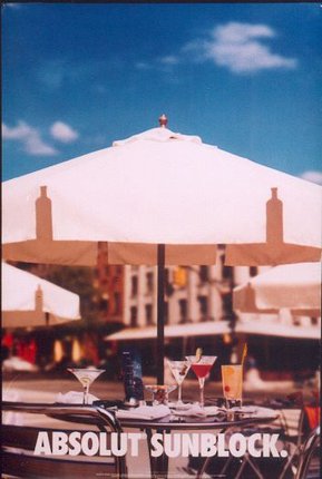 a table with drinks under an umbrella