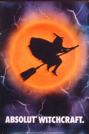 a silhouette of a person riding a broomstick