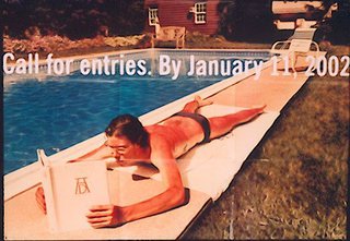 a man lying on a pool edge reading a book