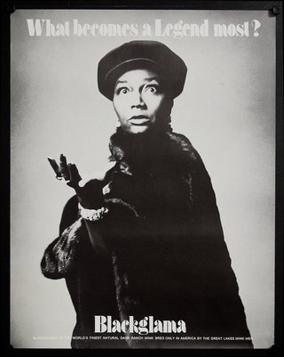 a woman in a black hat and fur coat