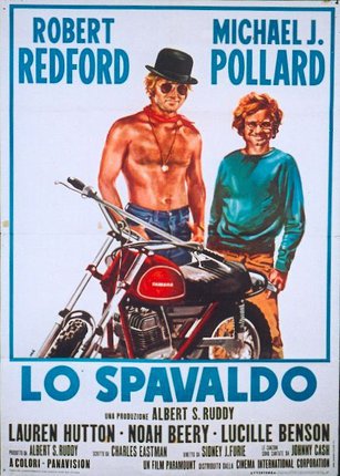 a poster of two men standing next to a motorcycle