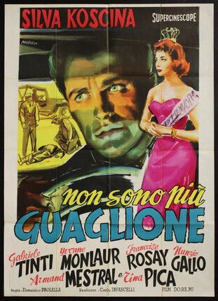 a movie poster with man's face and a beauty queen standing on his right
