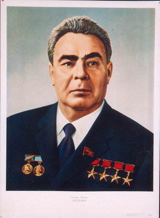 a man in a suit with medals
