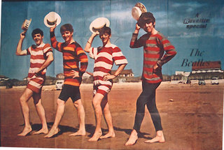 a group of men wearing striped shirts and holding hats