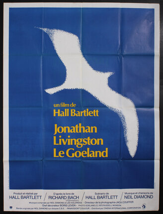 a blue and yellow poster with a bird