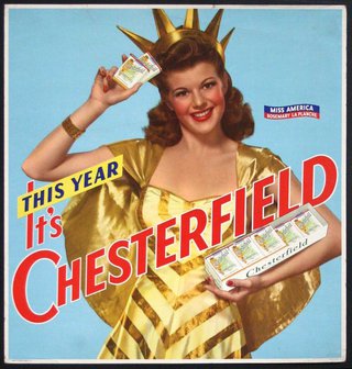 a woman in a gold dress holding a box of cigarettes